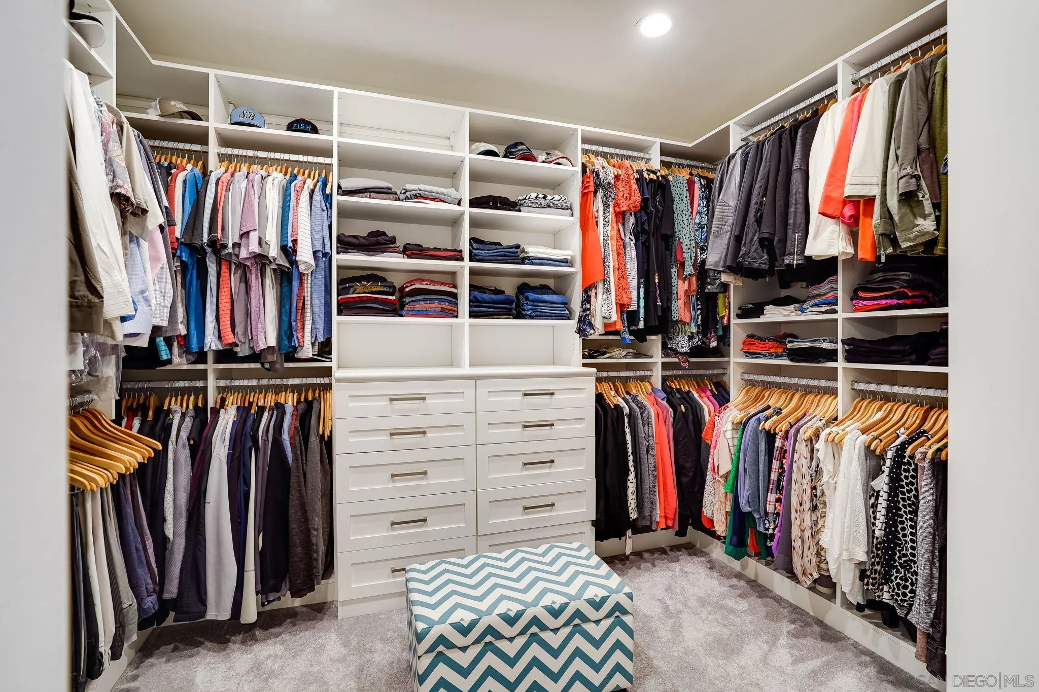 16375 Cayenne Ridge Road San Diego, CA 92127 - Photo 24 of 35 a view of walk in closet with clothes and shoes