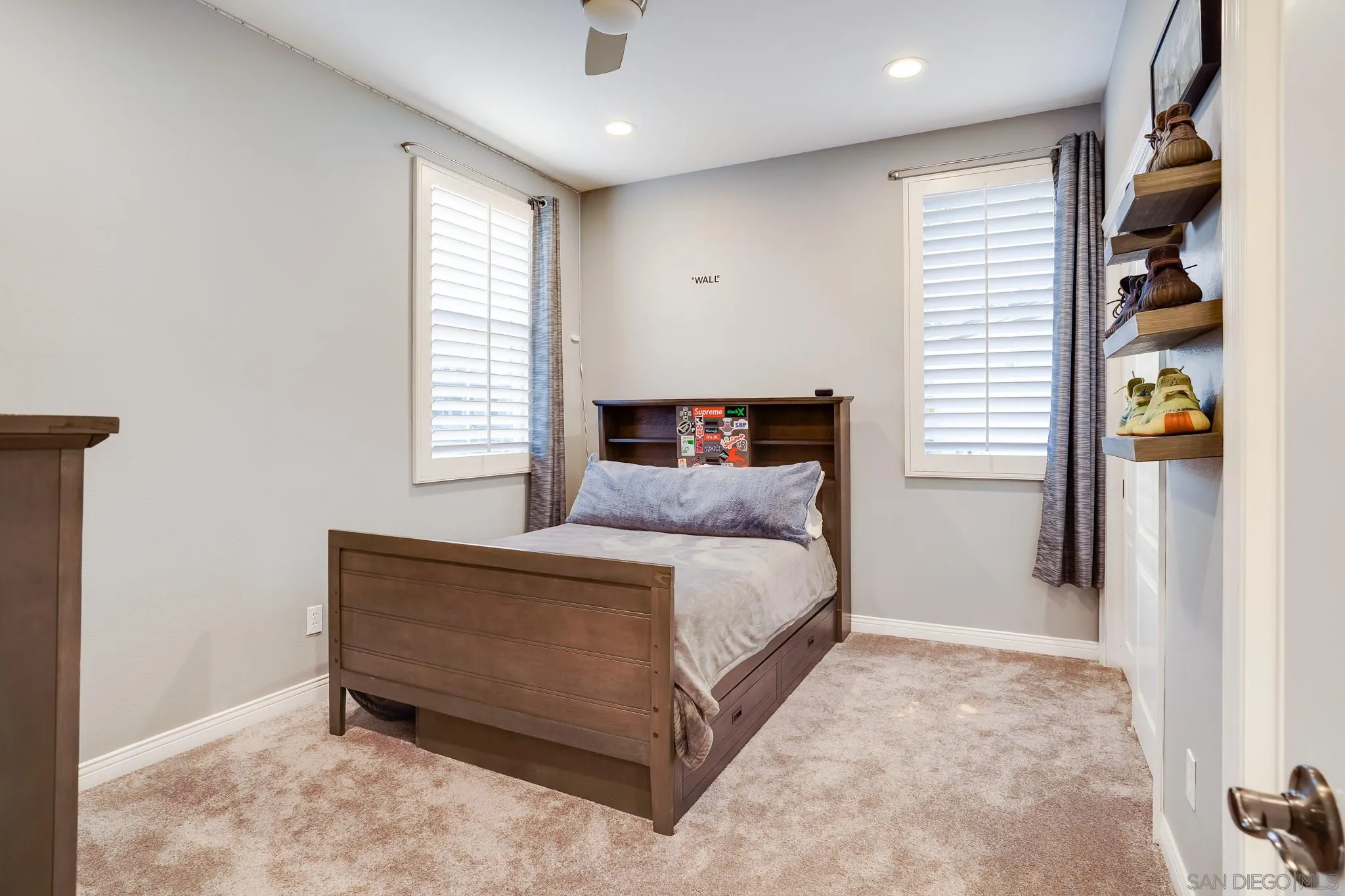 16375 Cayenne Ridge Road San Diego, CA 92127 - Photo 27 of 35 a spacious bedroom with a bed and window