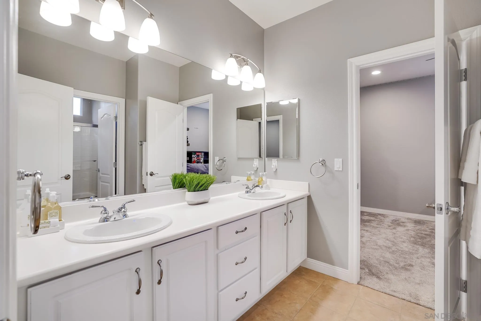 16375 Cayenne Ridge Road San Diego, CA 92127 - Photo 28 of 35 a bathroom with a sink double vanity and a mirror