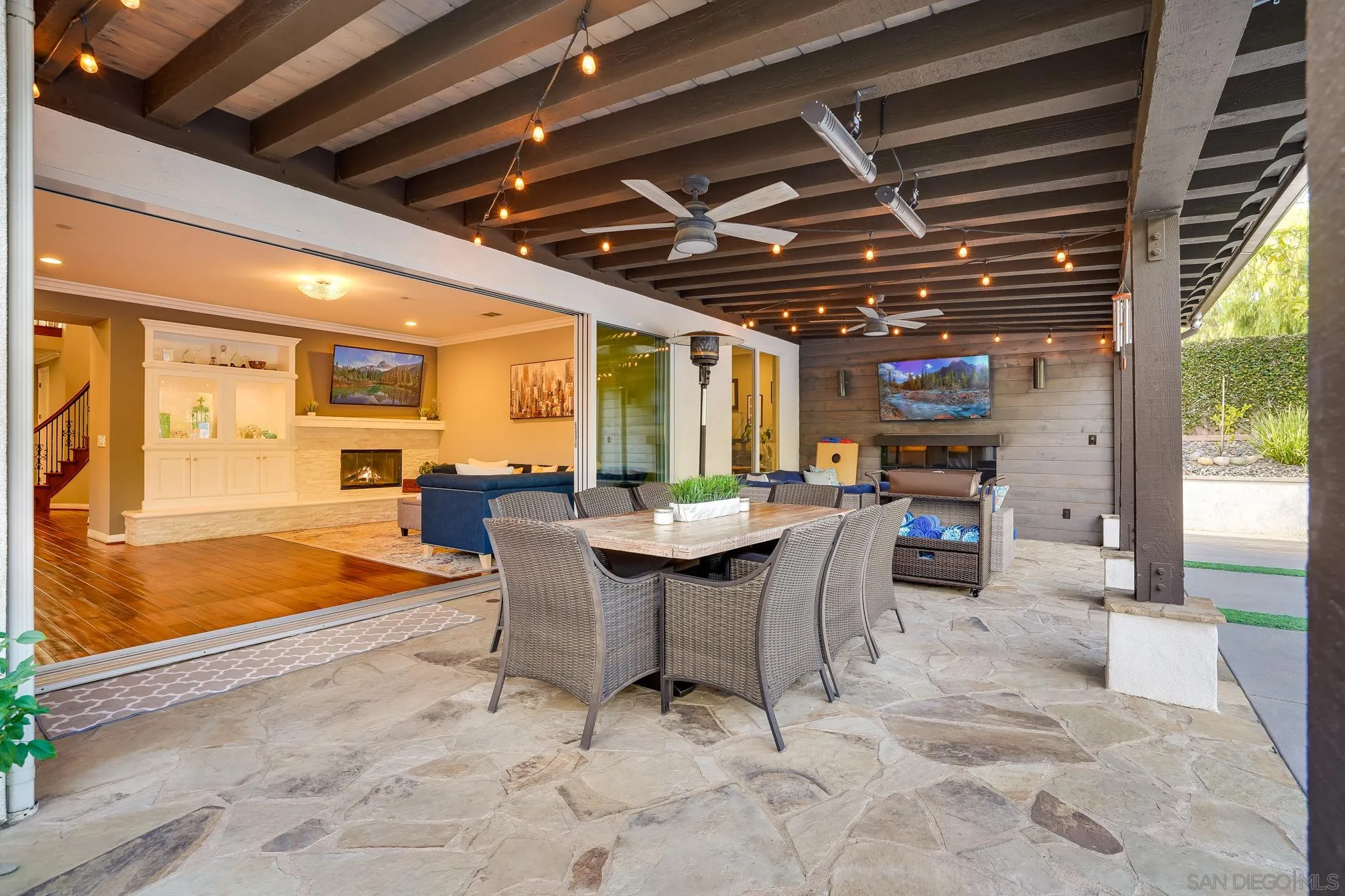 16375 Cayenne Ridge Road San Diego, CA 92127 - Photo 30 of 35 a dining room with furniture and a swimming pool