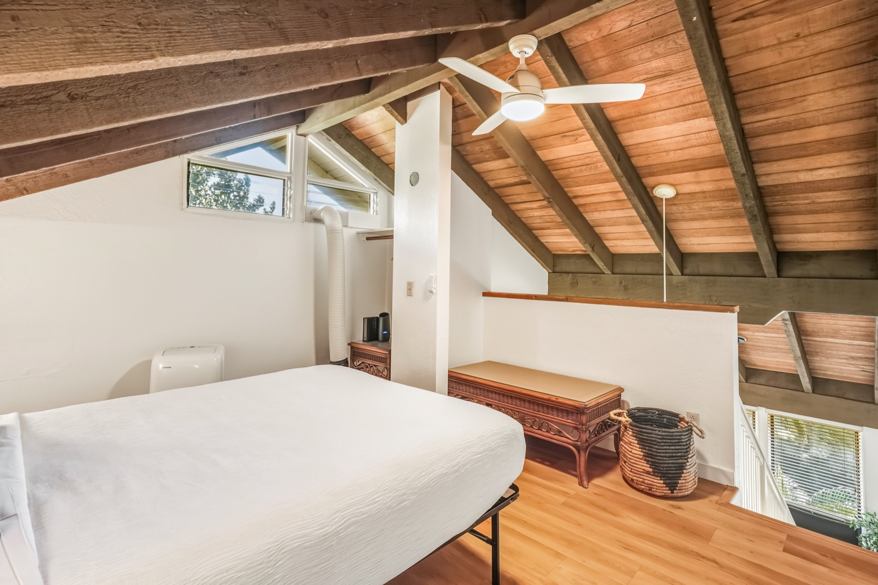 1901 Poipu Road, Unit 924 Koloa, HI 96756 - Photo 19 of 27 a bedroom with a bed and wooden floor