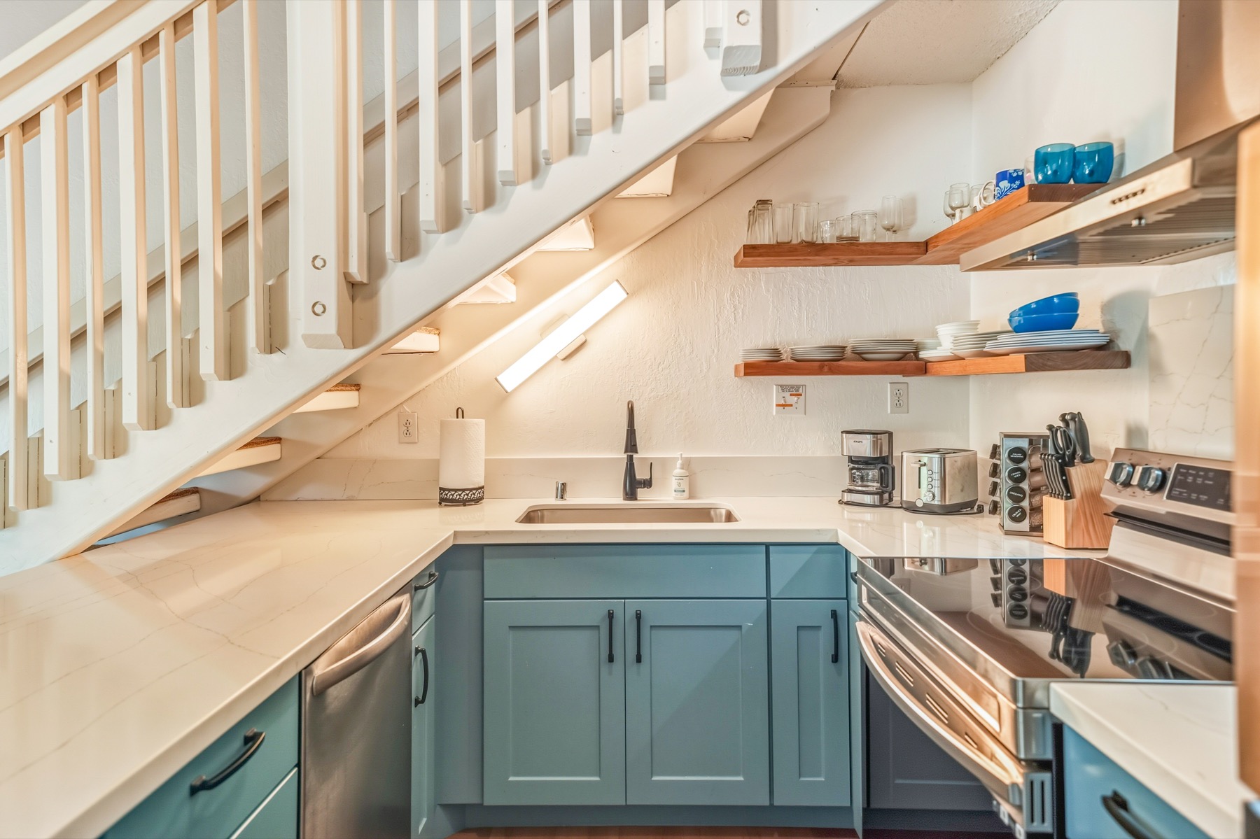 1901 Poipu Road, Unit 924 Koloa, HI 96756 - Photo 6 of 27 a kitchen with sink a stove and cabinets