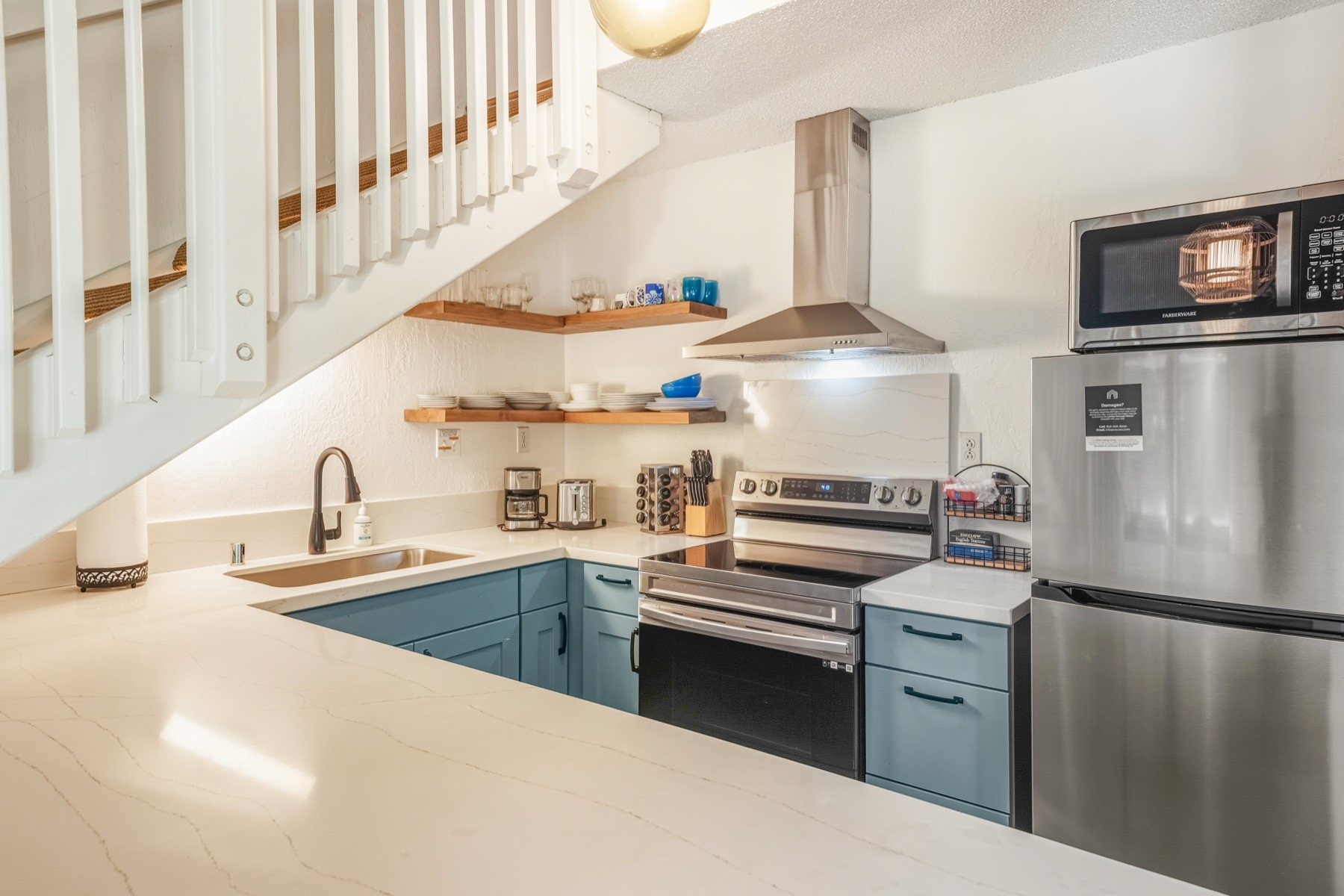 1901 Poipu Road, Unit 924 Koloa, HI 96756 - Photo 7 of 27 a kitchen with cabinets and stainless steel appliances