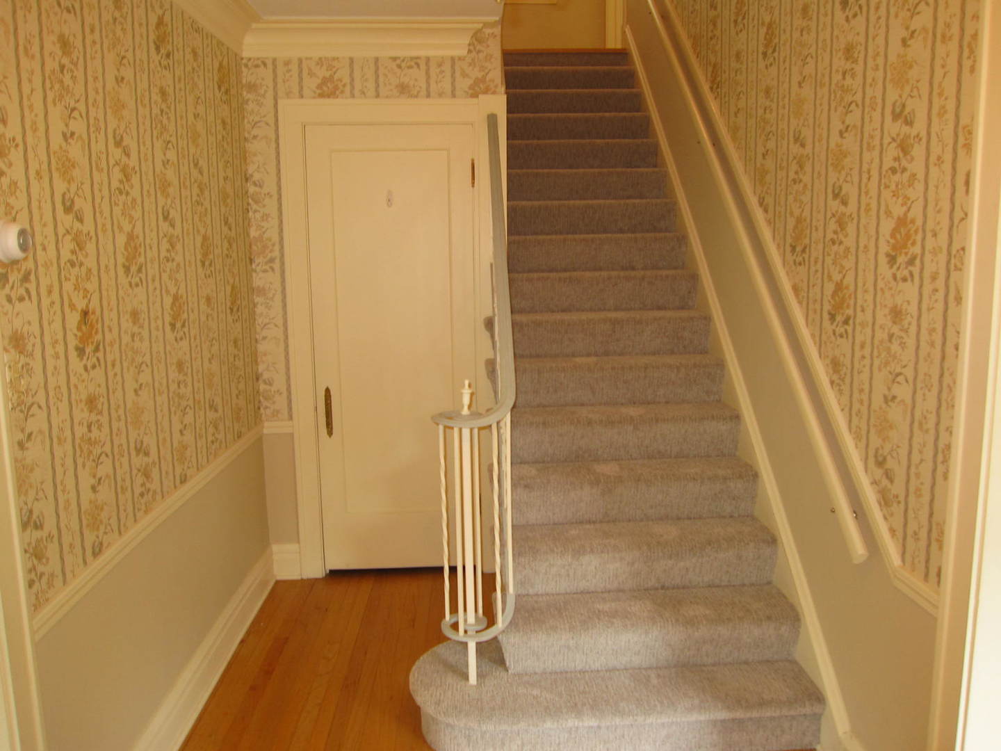 71 North Cowley Road Riverside, IL 60546 - Photo 11 of 23 a view of staircase with white walls and white door