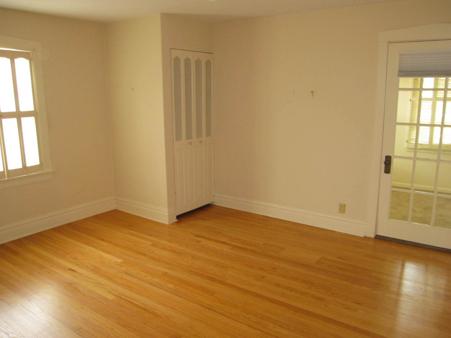 71 North Cowley Road Riverside, IL 60546 - Photo 12 of 23 an empty room with wooden floor and windows