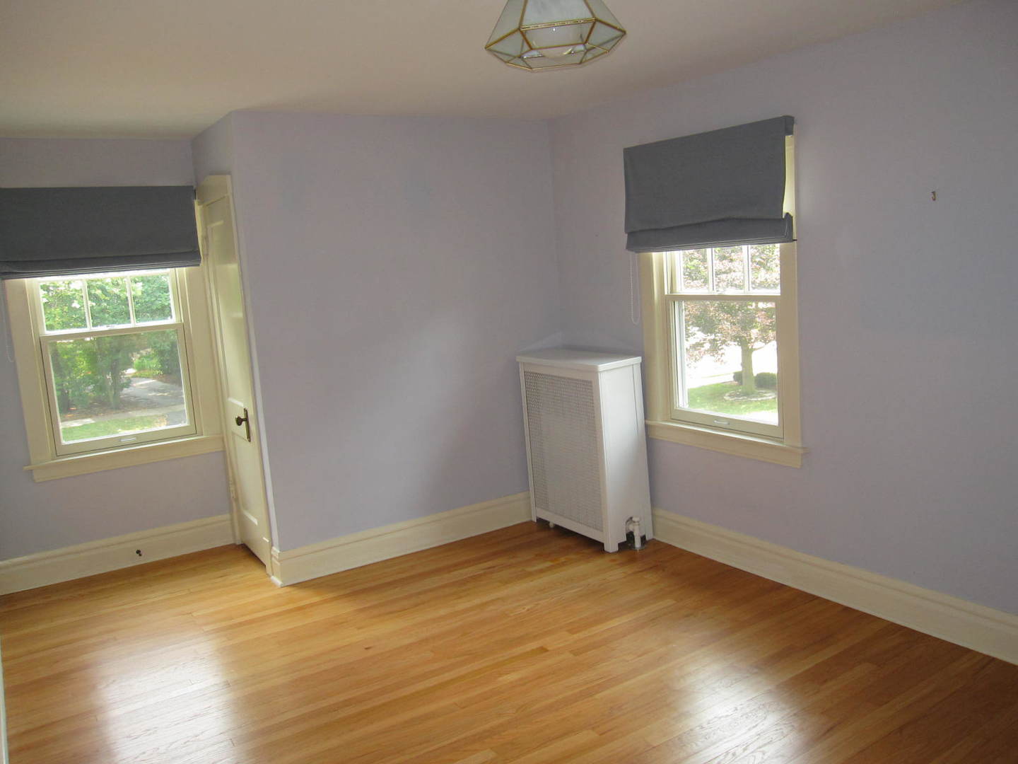71 North Cowley Road Riverside, IL 60546 - Photo 14 of 23 an empty room with wooden floor and windows