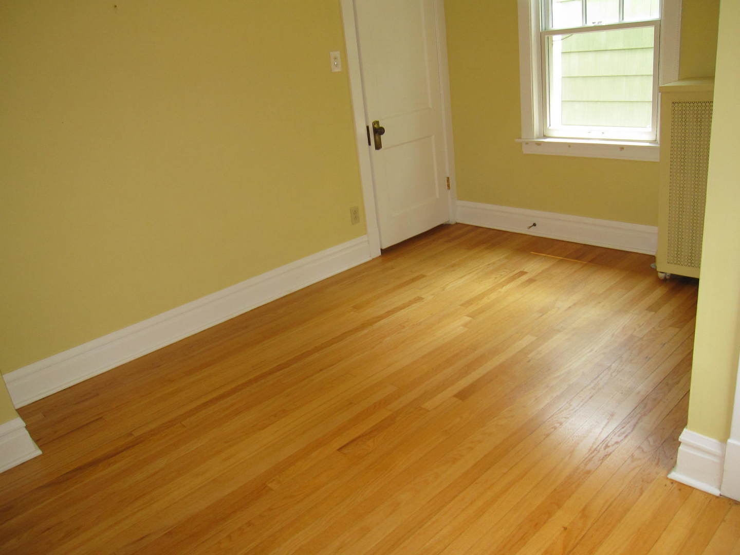 71 North Cowley Road Riverside, IL 60546 - Photo 15 of 23 an empty room with wooden floor and windows