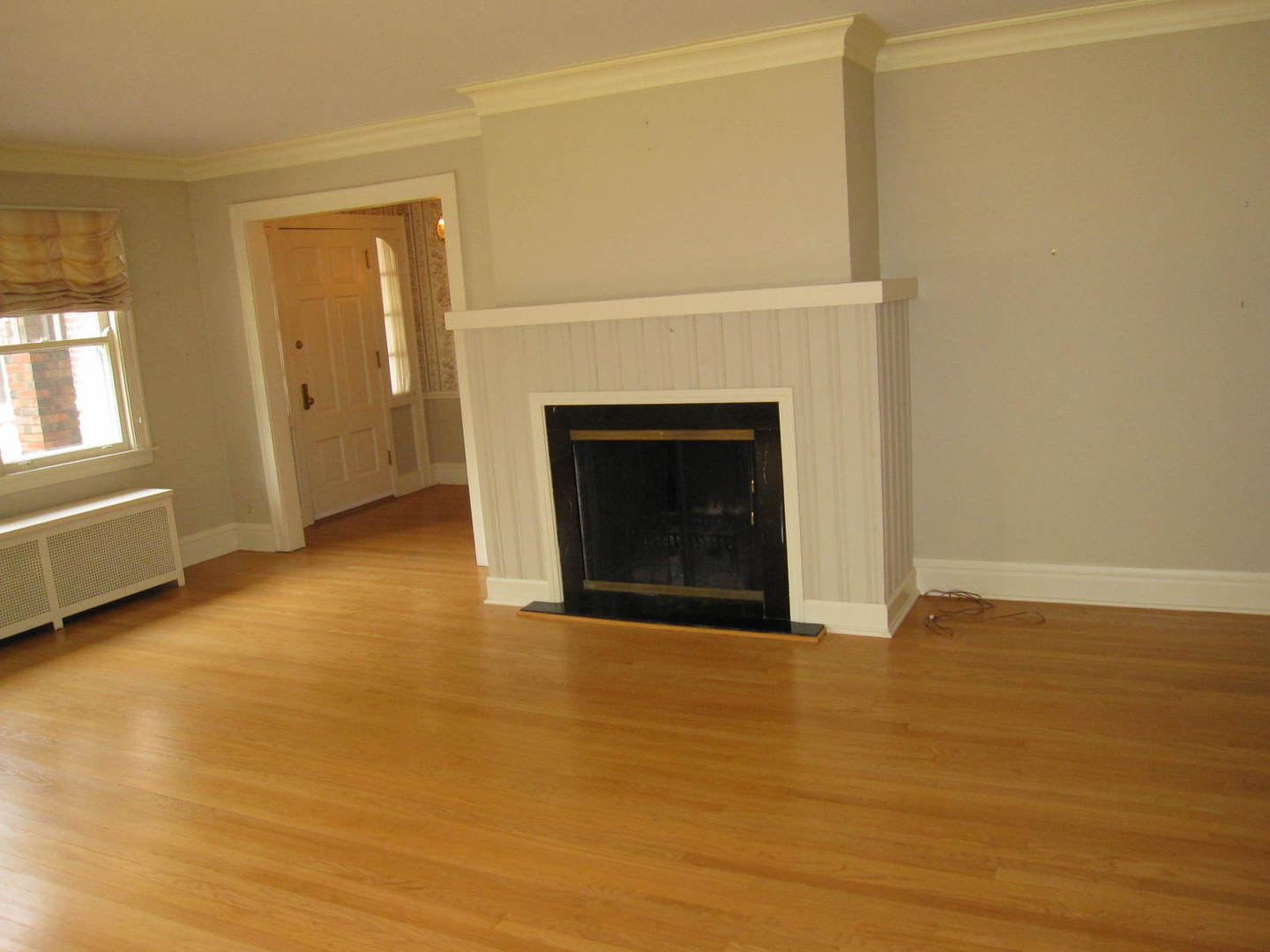 71 North Cowley Road Riverside, IL 60546 - Photo 4 of 23 a view of empty room with wooden floor and fireplace