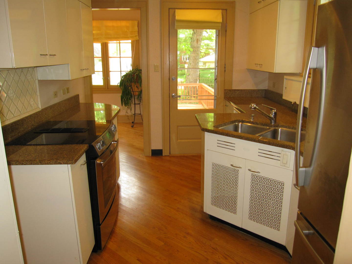 71 North Cowley Road Riverside, IL 60546 - Photo 6 of 23 a kitchen with a white stove top oven and sink