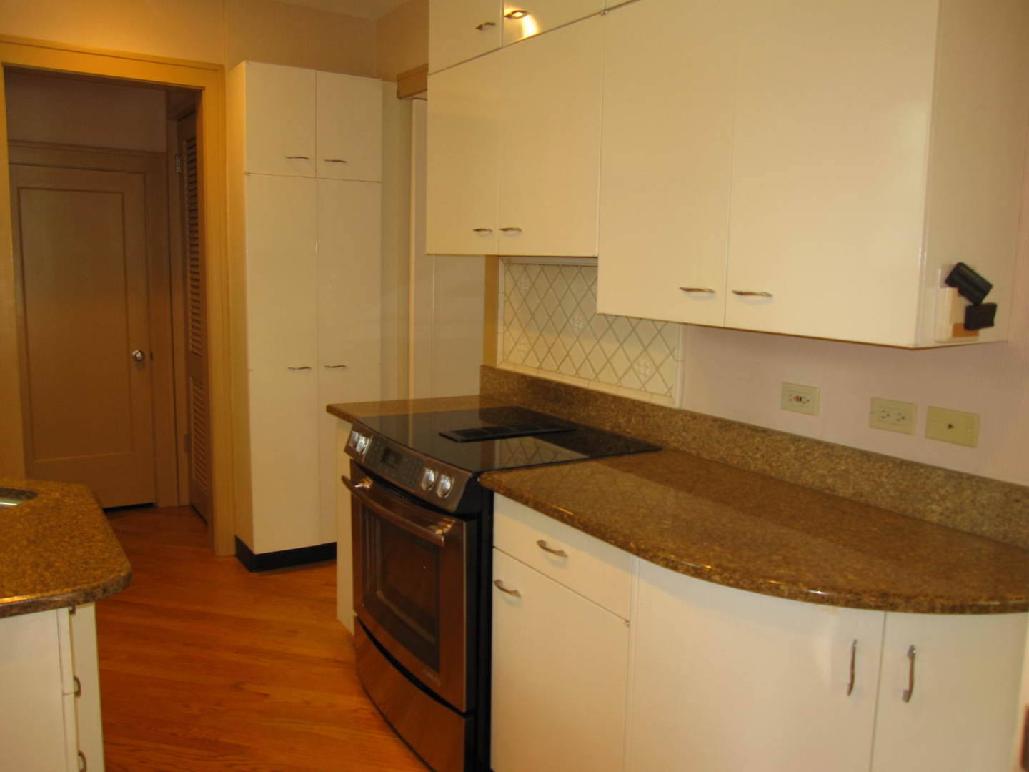 71 North Cowley Road Riverside, IL 60546 - Photo 7 of 23 a kitchen with a stove and a refrigerator