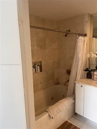 a kitchen with stainless steel appliances granite countertop a sink refrigerator and microwave