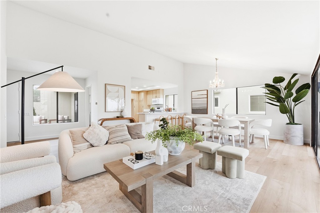22832 Dominita Road Laguna Niguel, CA 92677 - Photo 6 of 18 The spacious living room is bathed in natural light and anchored by a striking fireplace.