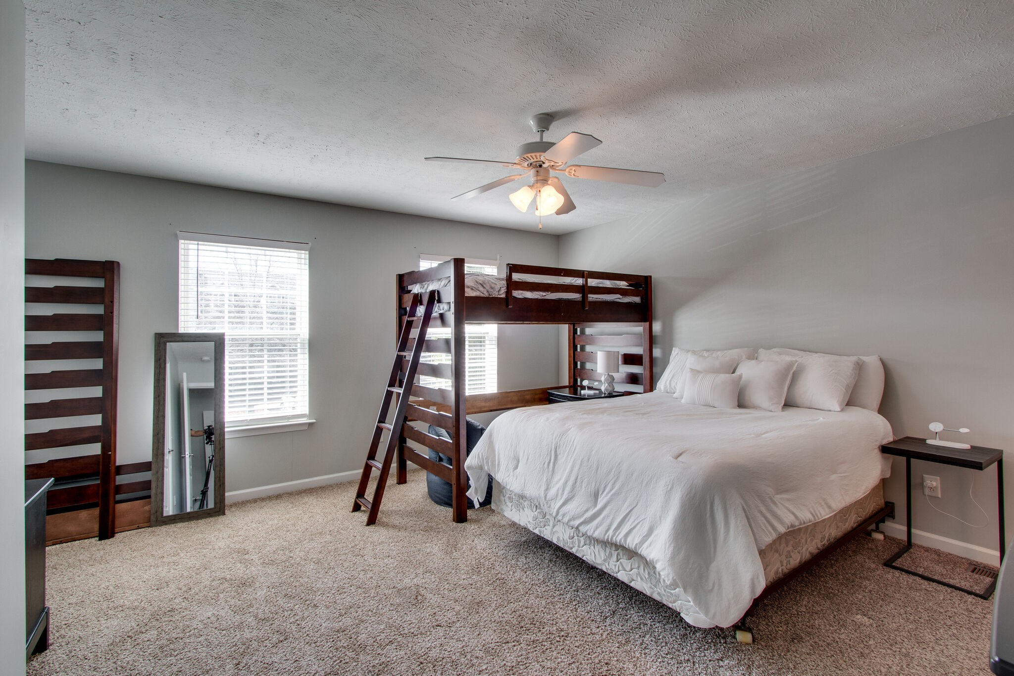 284 Meigs Drive, Unit D24 Murfreesboro, TN 37128 - Photo 11 of 16 a bedroom with a bed and a chandelier