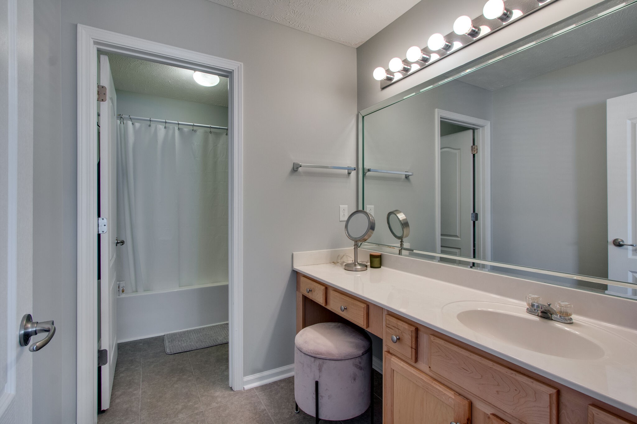 284 Meigs Drive, Unit D24 Murfreesboro, TN 37128 - Photo 13 of 16 a bathroom with a toilet sink and mirror