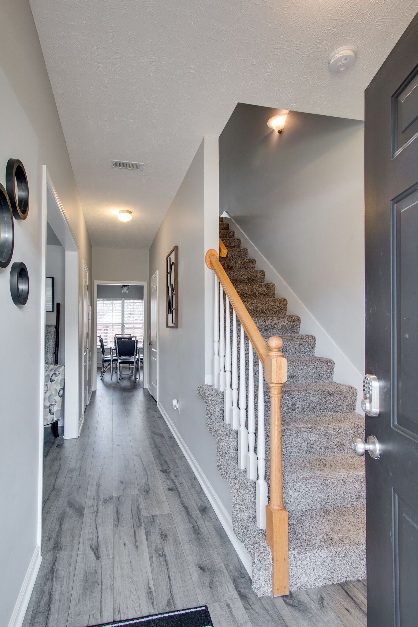 284 Meigs Drive, Unit D24 Murfreesboro, TN 37128 - Photo 3 of 16 a view of a livingroom with wooden floor and stairs