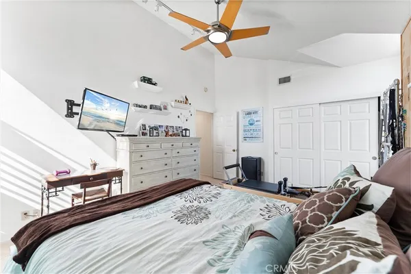 a bedroom with a bed dresser and a window