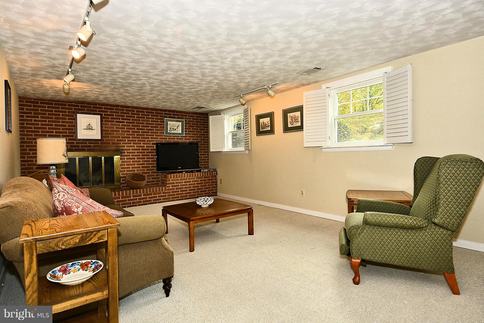 1344 Brenda Road Severn, MD 21144 - Photo 3 of 30 Lower Level Family Room / Brick Hearth Fireplace