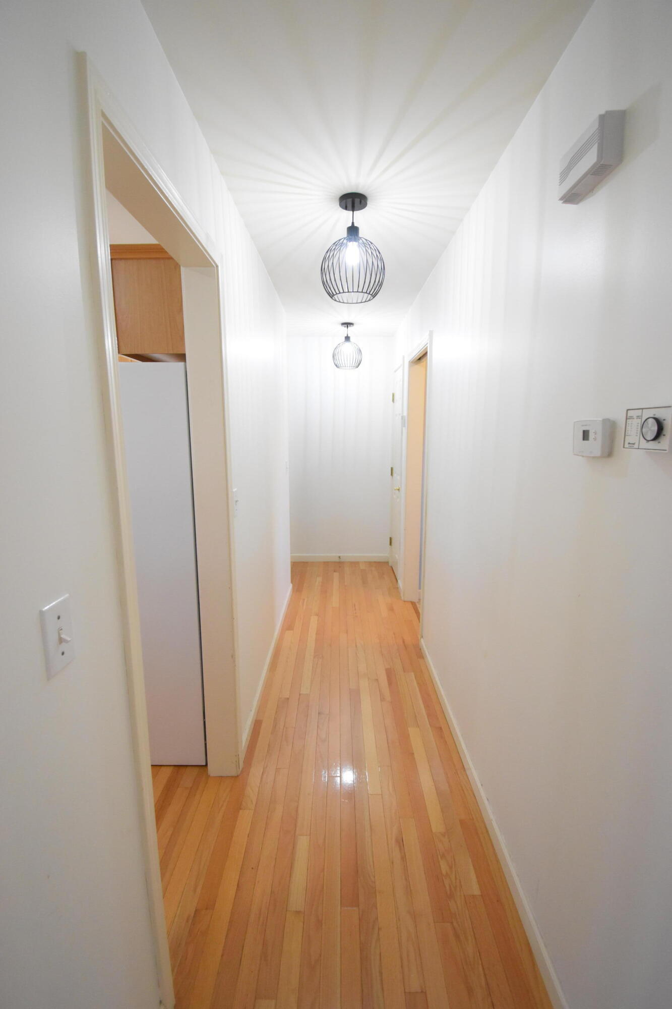 522 Pheasant Run Rensselaer, IN 47978 - Photo 32 of 55 a view of a hallway with wooden floor