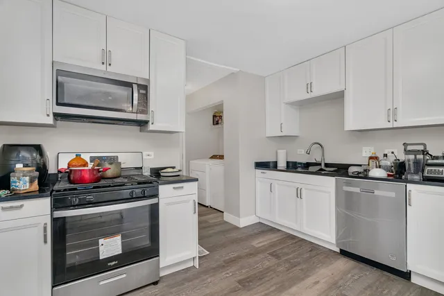 a kitchen with a stove and a refrigerator