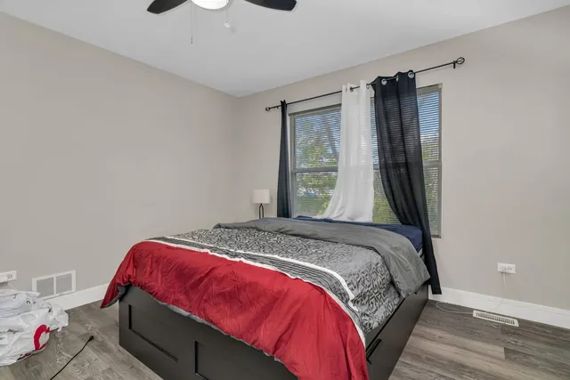 a view of bedroom with furniture and a window