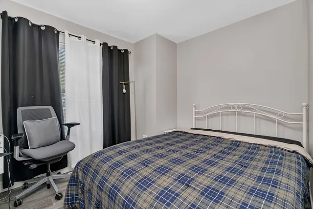 a room with a wooden floor and gym equipment