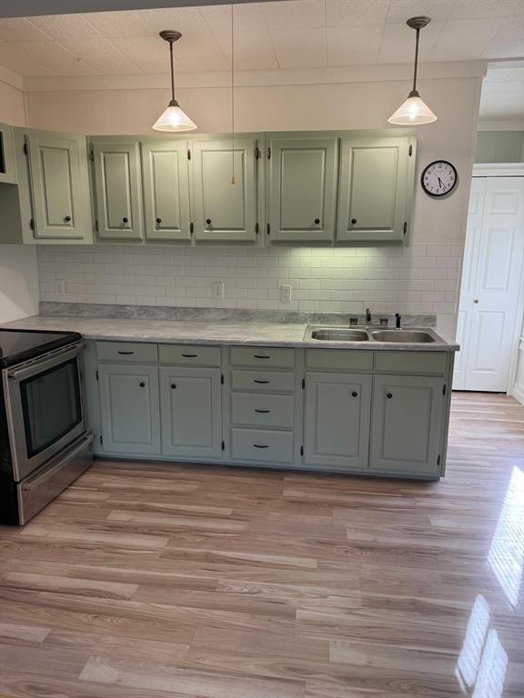 7105 Rodessa Ida Road Ida, LA 71044 - Photo 29 of 40 a kitchen with stainless steel appliances granite countertop a sink a stove and a wooden floors