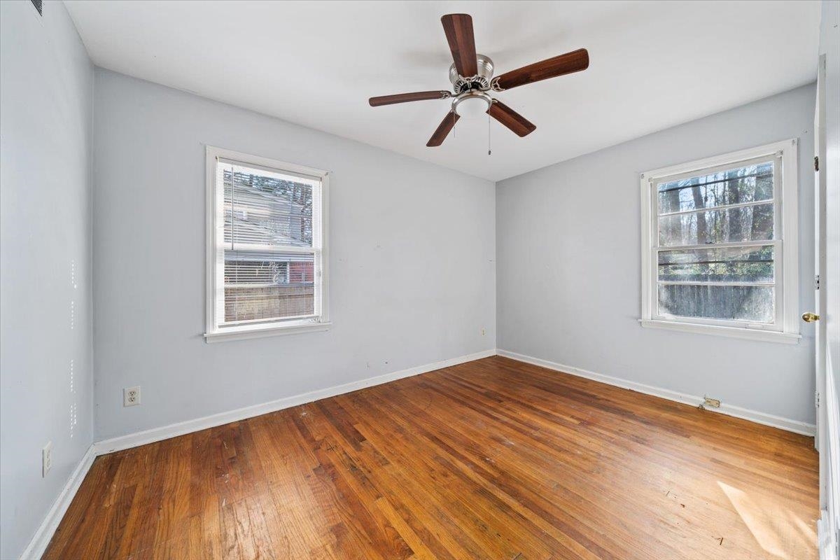 1821 Dale Lavern Road Memphis, TN 38116 - Photo 20 of 21 a view of empty room with wooden floor and fan