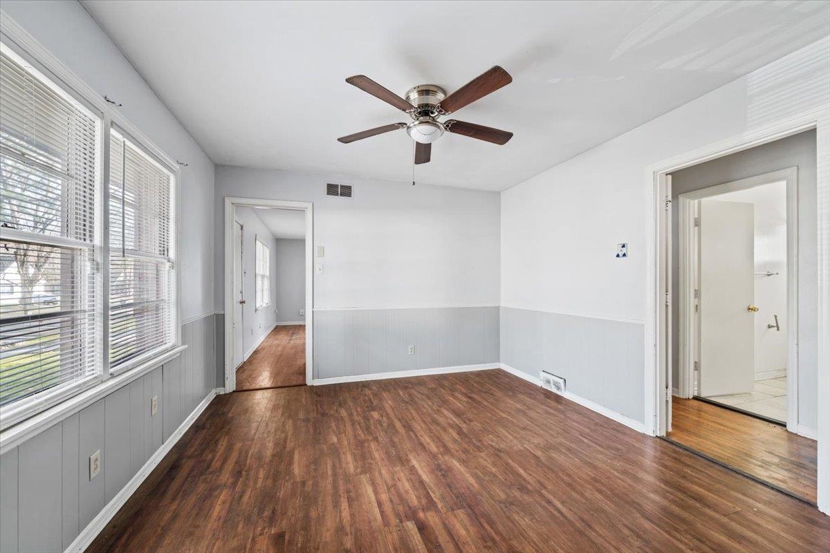 1821 Dale Lavern Road Memphis, TN 38116 - Photo 5 of 21 a view of empty room with wooden floor and fan