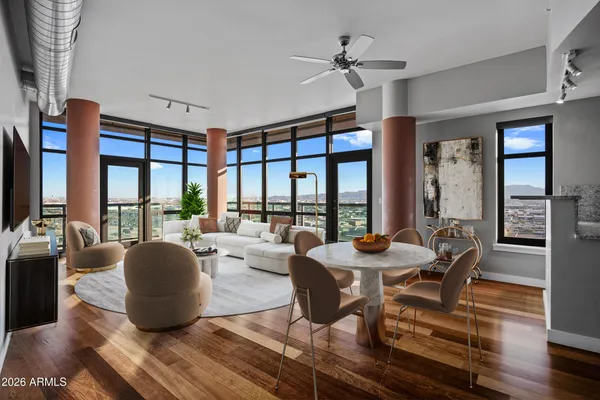 a living room with furniture and a large window