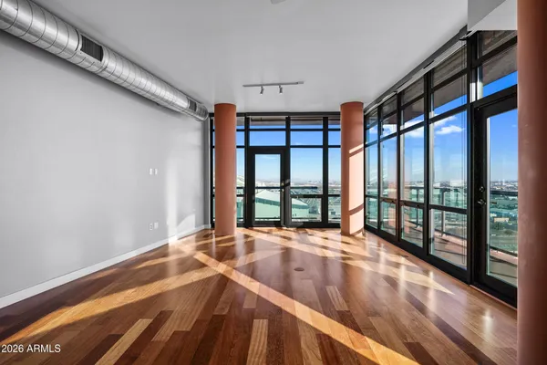 a view of an empty room with a window