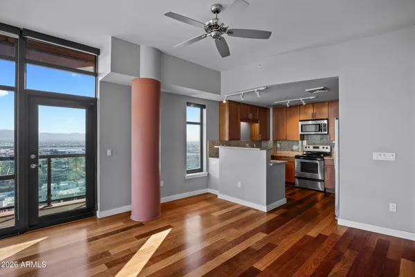 a view of a kitchen with wooden floor and a kitchen