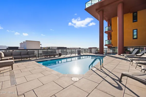 a view of a patio with swimming pool