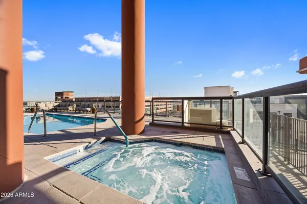 a view of a swimming pool with chairs