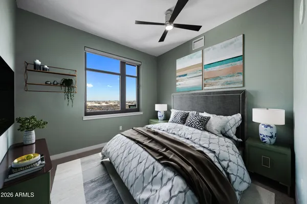 a bedroom with a bed and a window