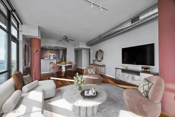 a living room with furniture and a flat screen tv