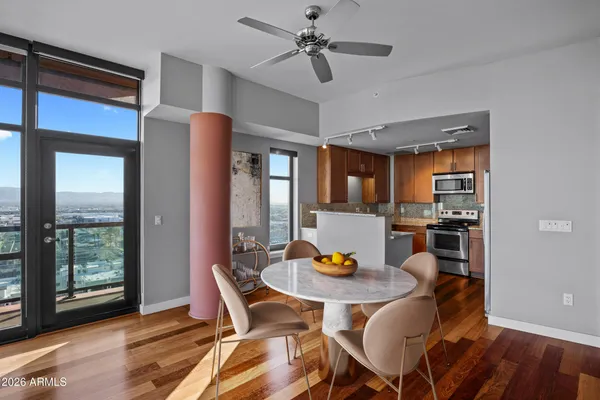 a view of a dining room with furniture window and wooden floor