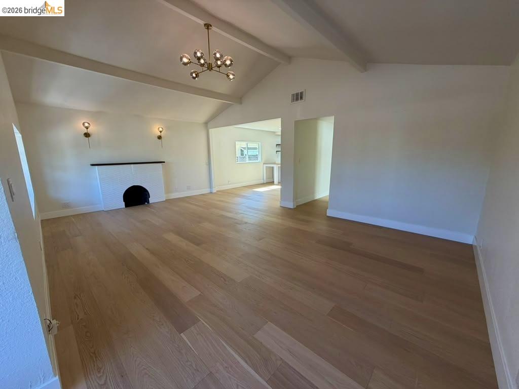 1327 Ward Street Berkeley, CA 94702 - Photo 4 of 8 a view of a big room with wooden floor
