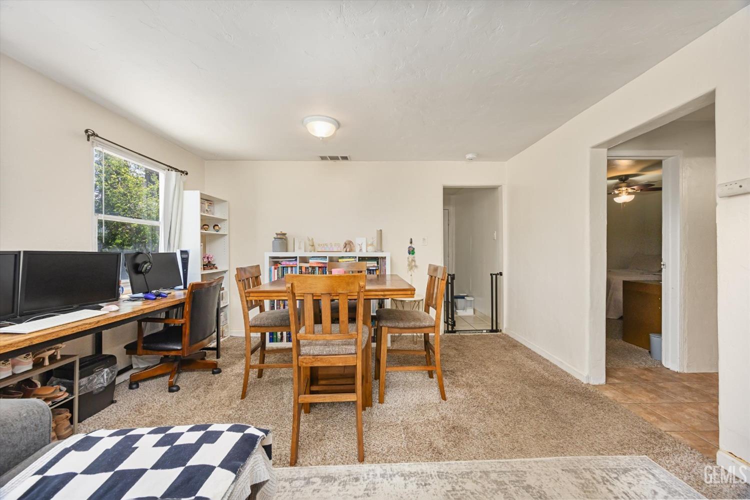 Undisclosed Address Bakersfield, CA 93304 - Photo 11 of 25 a dining room with furniture and a flat screen tv