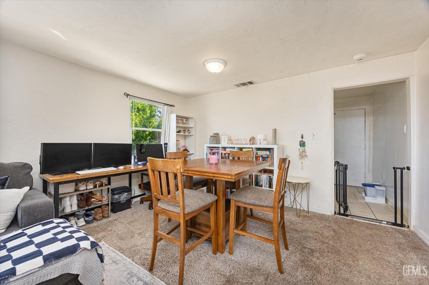 Undisclosed Address Bakersfield, CA 93304 - Photo 12 of 25 a view of a dining room with furniture and a window