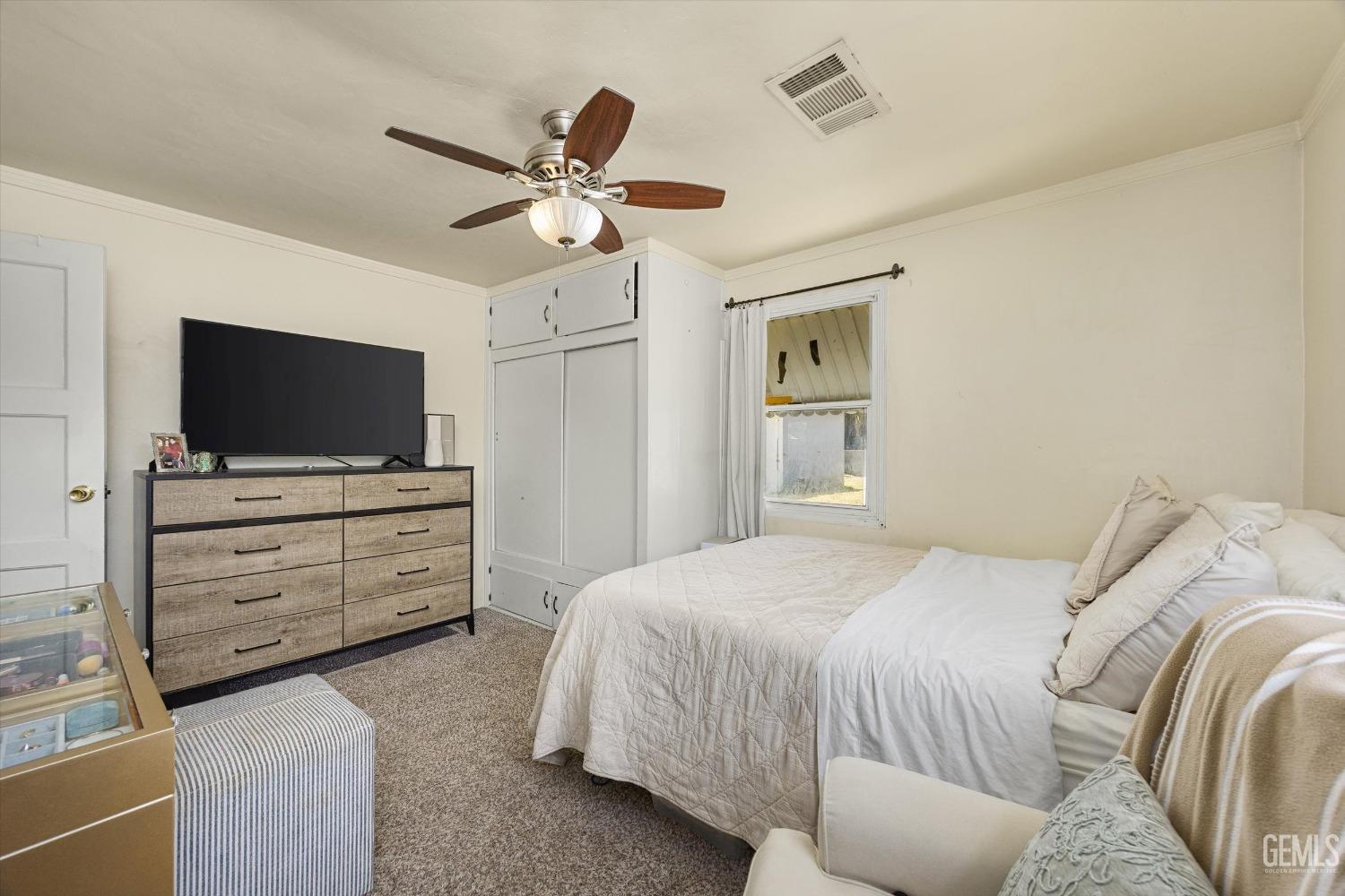 Undisclosed Address Bakersfield, CA 93304 - Photo 19 of 25 a bedroom with a bed and a flat screen tv