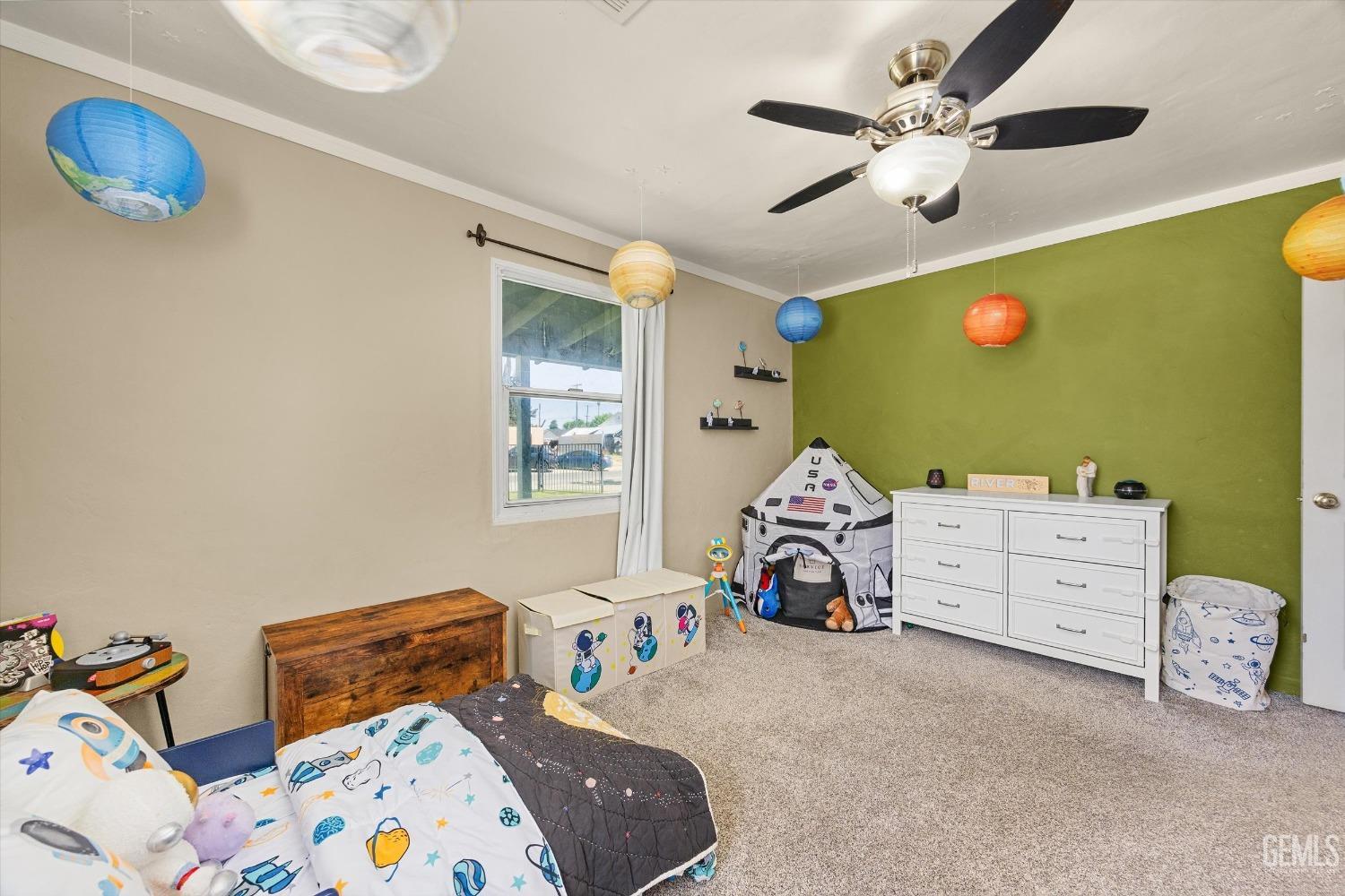 Undisclosed Address Bakersfield, CA 93304 - Photo 22 of 25 a bedroom with a bed and a chandelier