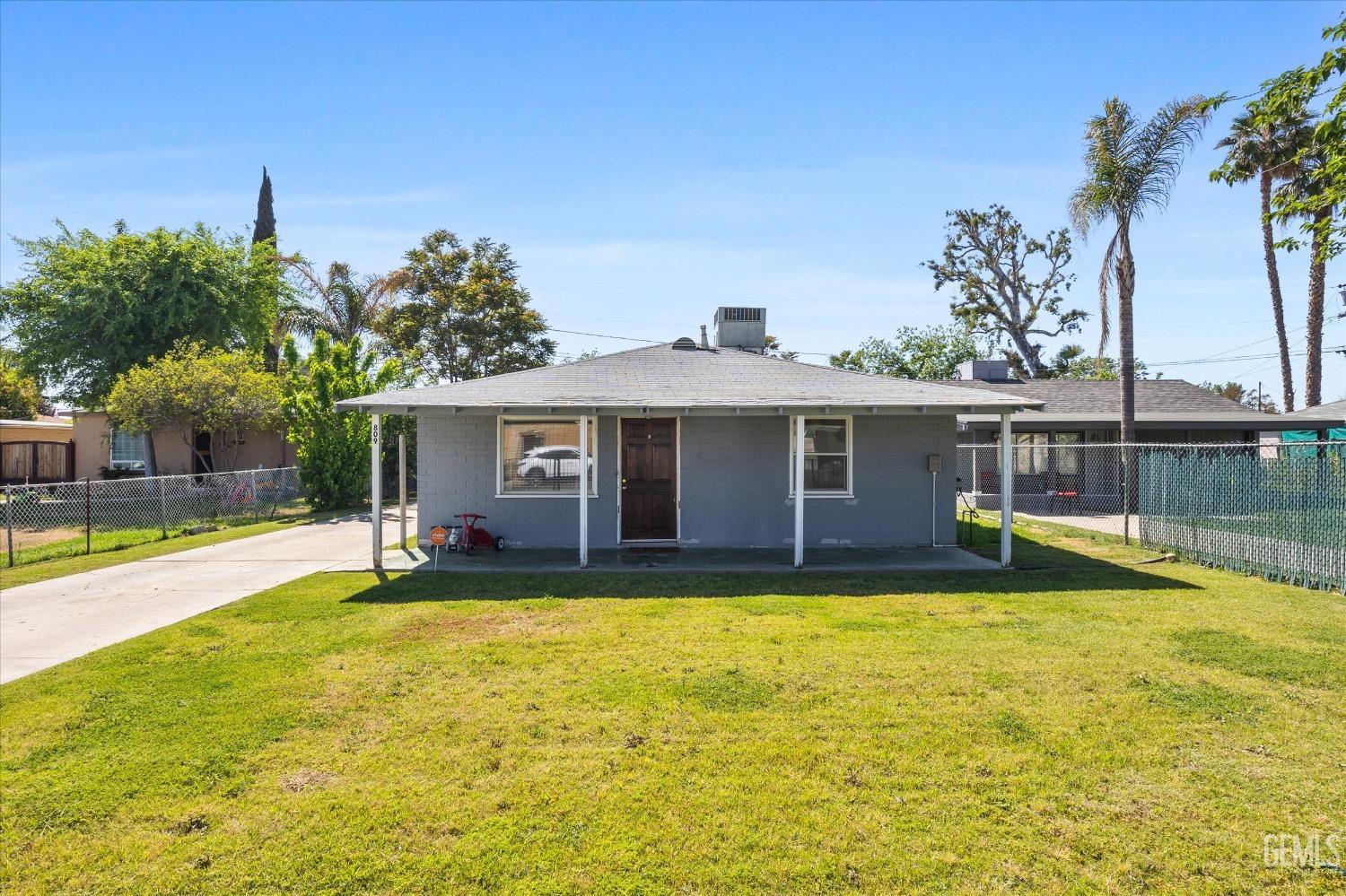 Undisclosed Address Bakersfield, CA 93304 - Photo 6 of 25 a view of a house with swimming pool and a yard