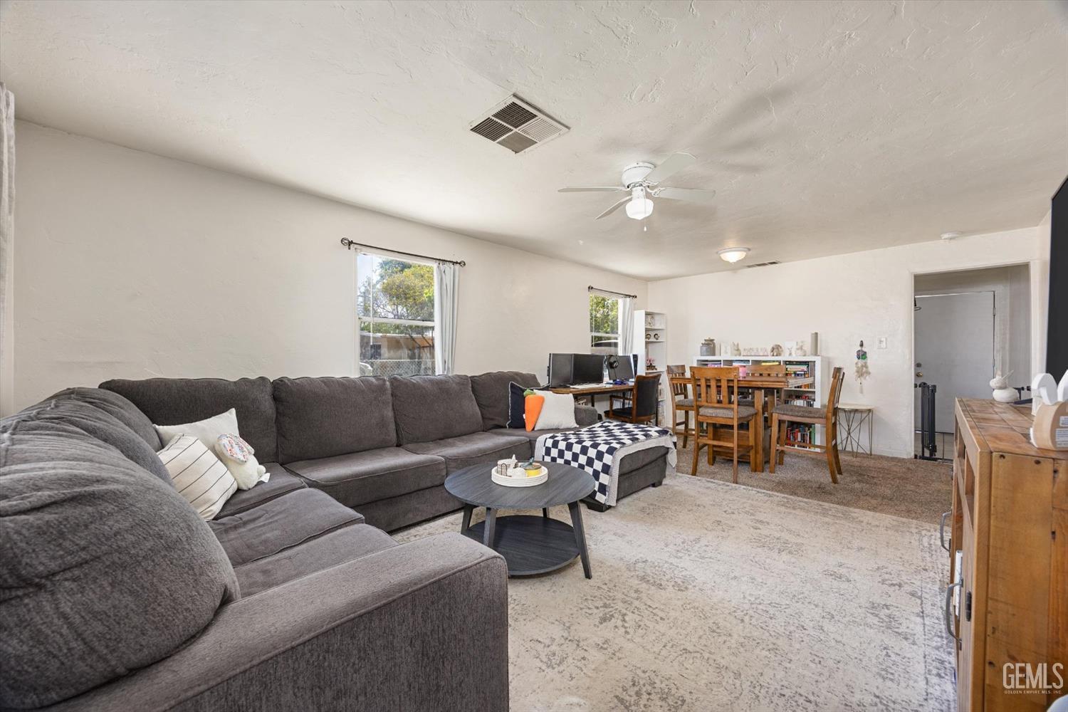 Undisclosed Address Bakersfield, CA 93304 - Photo 7 of 25 a living room with furniture and a large window