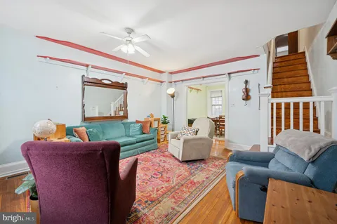 a living room with fireplace furniture and a window