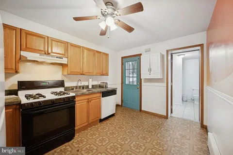 a kitchen with a stove oven and a refrigerator