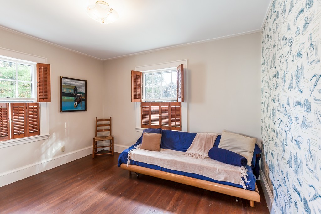 27 Samoset Road Newton, MA 02468 - Photo 12 of 18 a bedroom with a bed and wooden floor