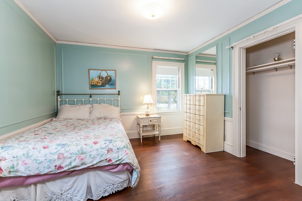27 Samoset Road Newton, MA 02468 - Photo 14 of 18 a bedroom with a bed and wooden floor