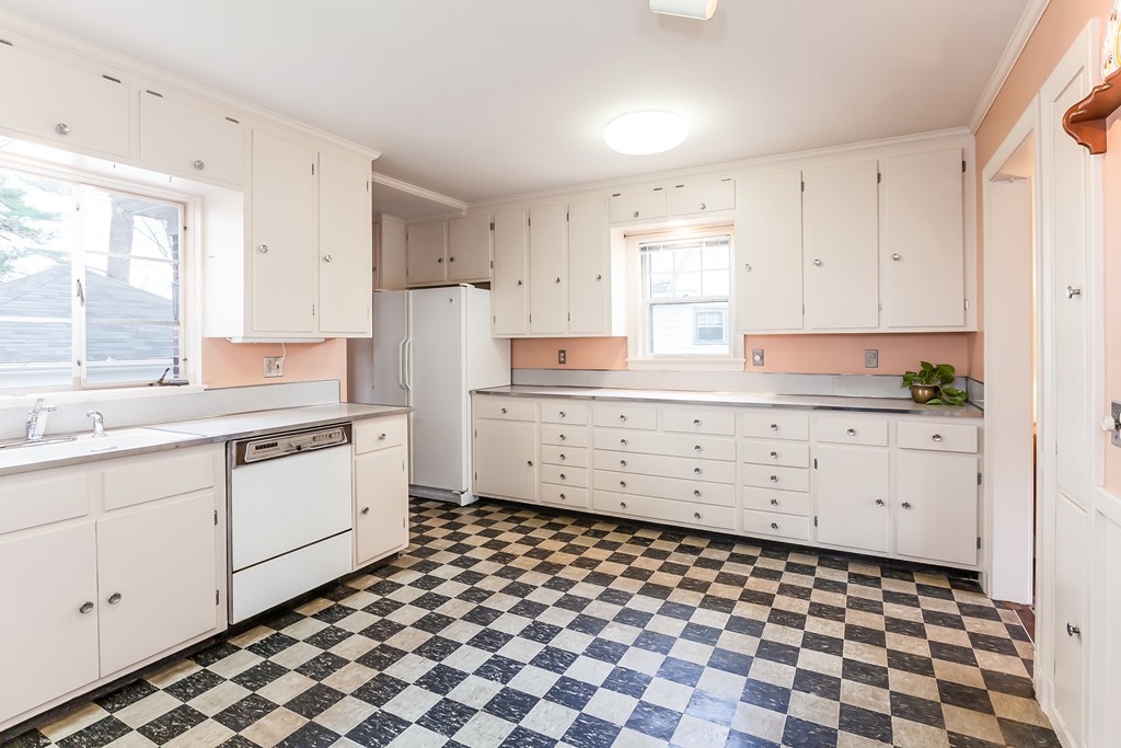 27 Samoset Road Newton, MA 02468 - Photo 5 of 18 a kitchen with a checkered floor and white cabinets