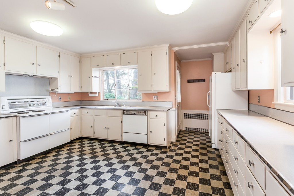 27 Samoset Road Newton, MA 02468 - Photo 6 of 18 a kitchen with a checkered floor and white cabinets
