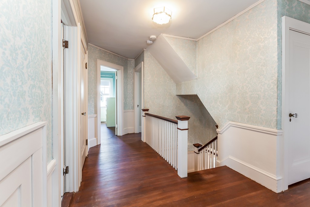 27 Samoset Road Newton, MA 02468 - Photo 7 of 18 a view of a hallway with the wooden floor and entryway
